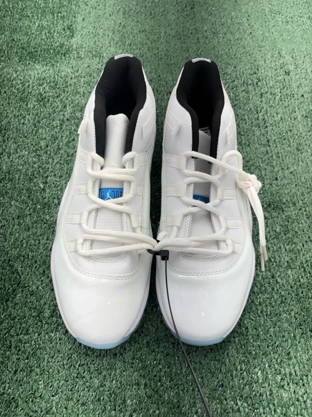 Jordan Men's White Athletic Shoes with Black Interior and Light Blue Accents